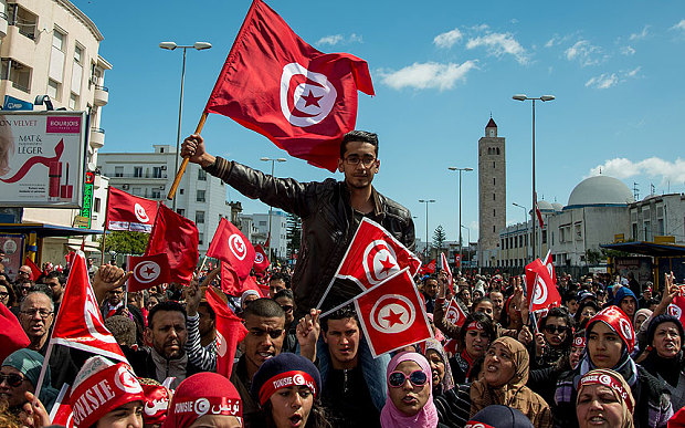 Tunisians march against beach attack